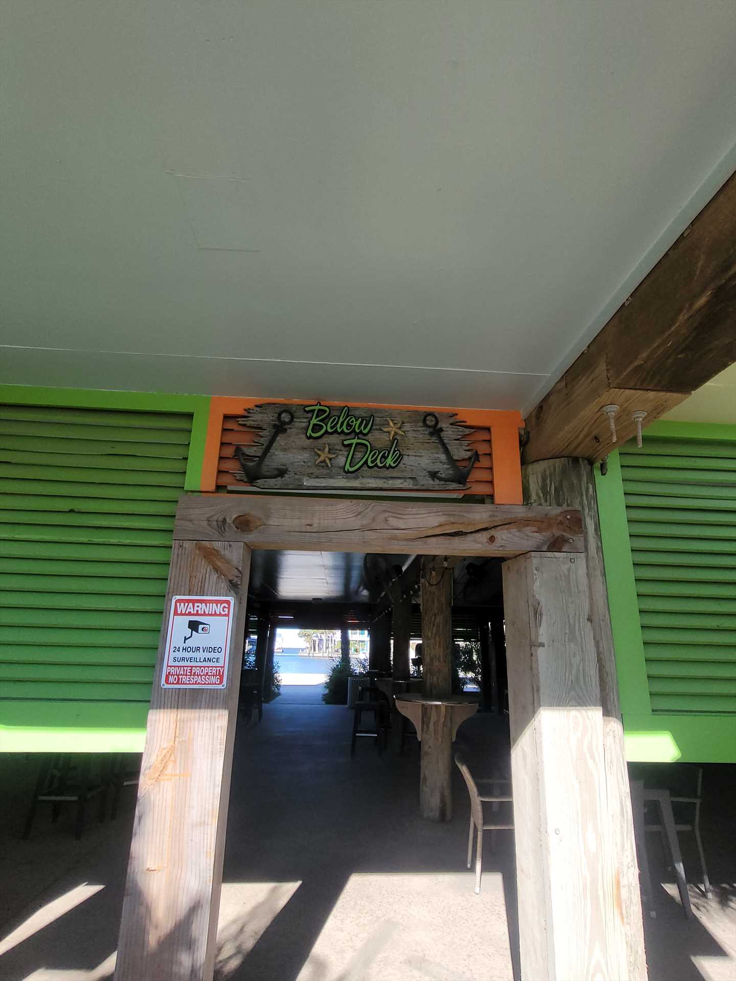 Below decxk bar entrance from street